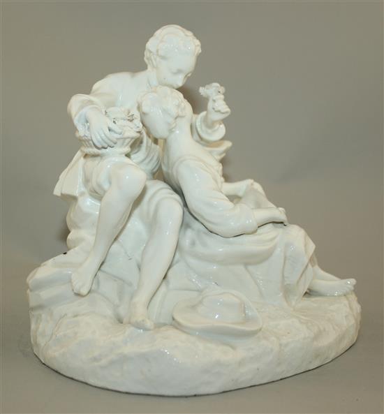 A Continental white glazed porcelain group of two lovers, late 19th century, 19cm, slight restoration